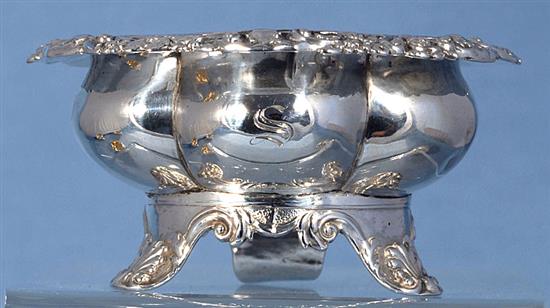 A set of four George III provincial silver table salts with matching mustard, Diameter 3 ¾”/94mm combined weight 21.5oz/609grm